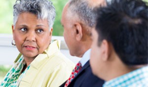 image of woman talking with two men